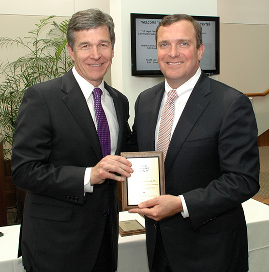 Peebles Harrison Accepts Award